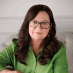 Woman in glasses and a green shirt