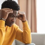 Man with head in hands